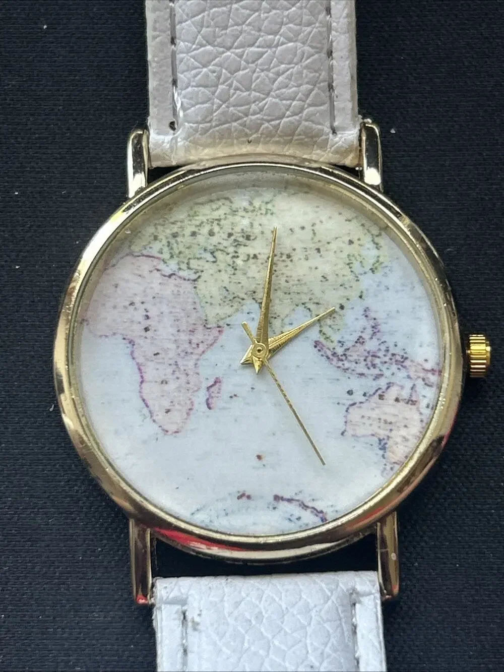 Eastern Hemisphere Gold Tone White Band Quartz Watch